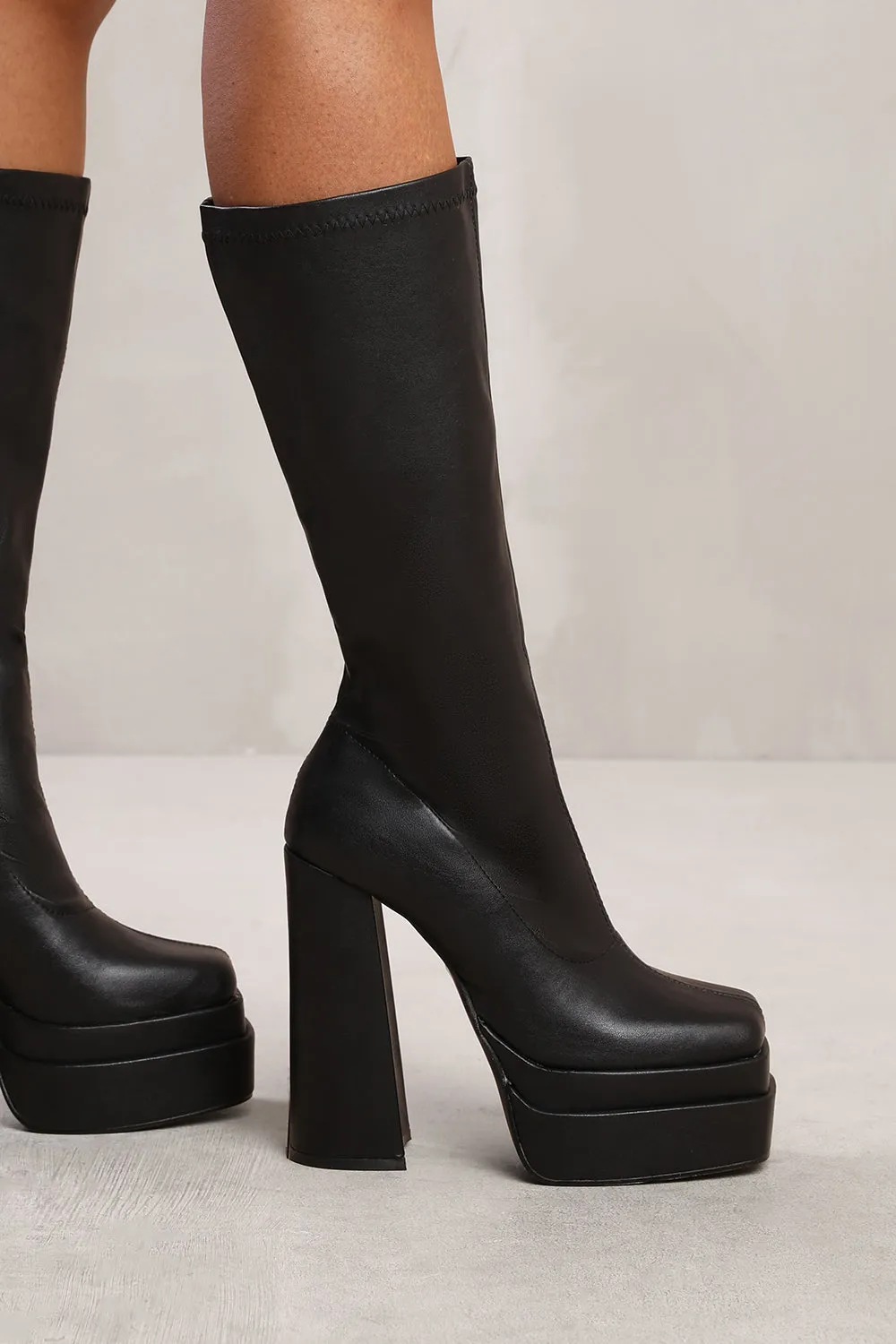 GWEN BELOW KNEE BLOCK HEEL PLATFORM BOOT IN BLACK